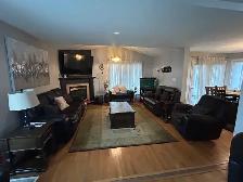 Dark brown leather recliner sofa set with loveseat