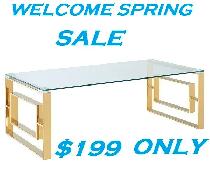 EROS COFFEE TABLE IN POLISHED GOLD AND THICK GLASS..