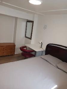 A brand new private day room with a queen-size bed