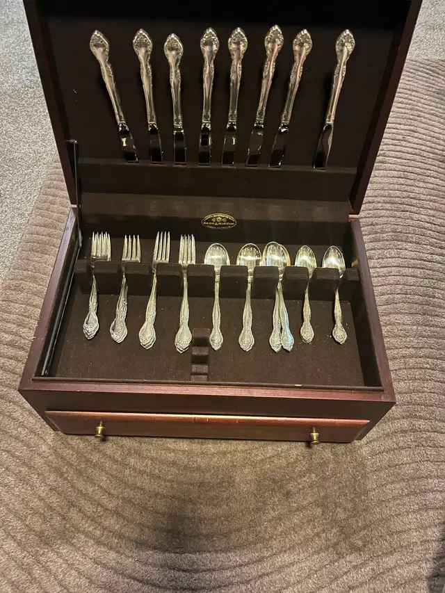 S.S. dining utensils and cherry storage chest