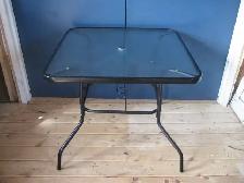 Square glass top patio table