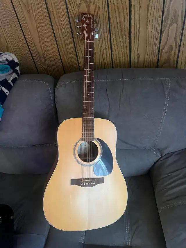 Simon and Patrick solid top acoustic guitar