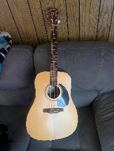 Simon and Patrick solid top acoustic guitar