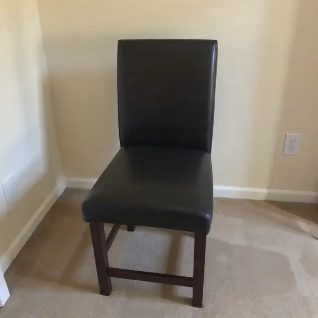 Black leather parsons chair (rips)