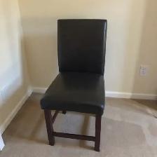 Black leather parsons chair (rips)