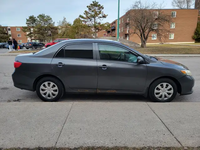 2010 Toyota Corolla fuel efficient manual four door sedan