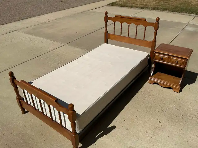 Single maple bed and night table.