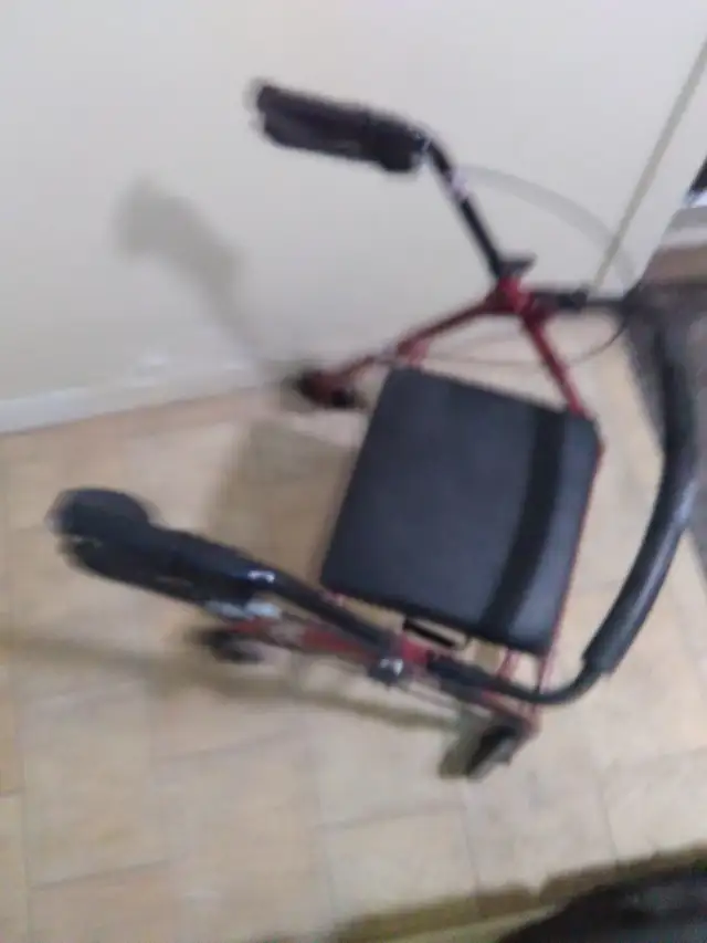 New four wheeled walker with brakes and seat with storage