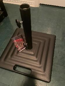 Brand New Treasure Garden 100lb metal umbrella stand on wheels