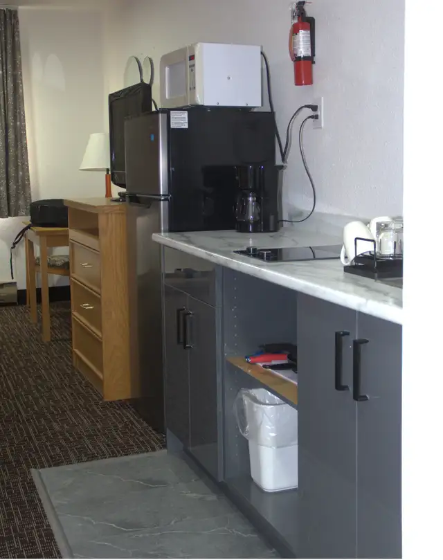 Affordable Weekly & Monthly Hotel Rooms – Clean & Comfortable - Photo 19