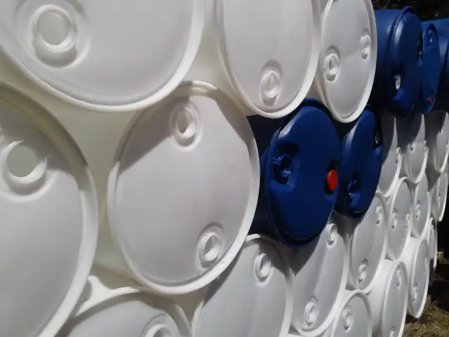 55 gallons plastic barrels, 2 caps on top.