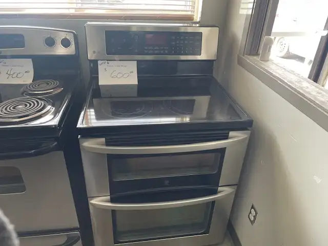 Cuisinière stainless vitrocéramique double fours LG