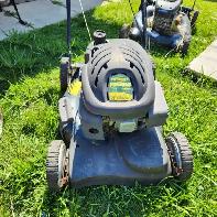 Three gasoline lawnmowers.