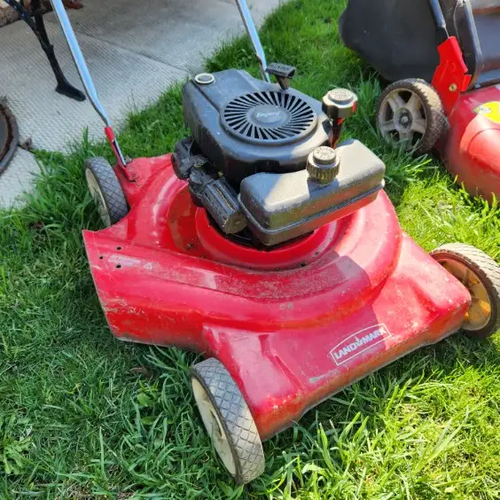 Three gasoline lawnmowers. - Photo 3