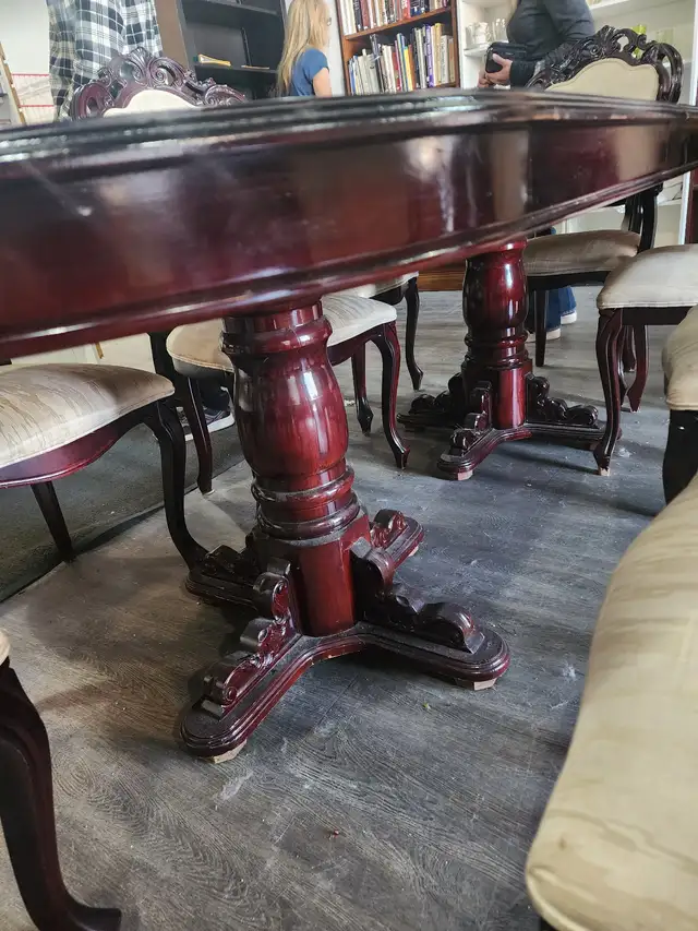 Large table with a leaf and 8 chairs will work fine