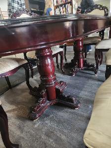 Large table with a leaf and 8 chairs will work fine