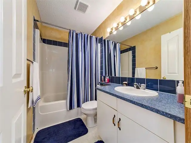 137 Rocky Ridge LD NWBasement for rent (Private washroom inc) - Photo 4