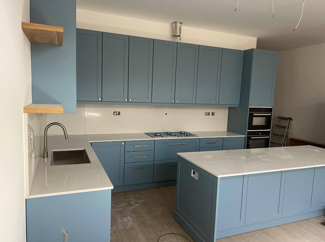 Plain White Countertop With Beautiful Blue Island - Photo 3