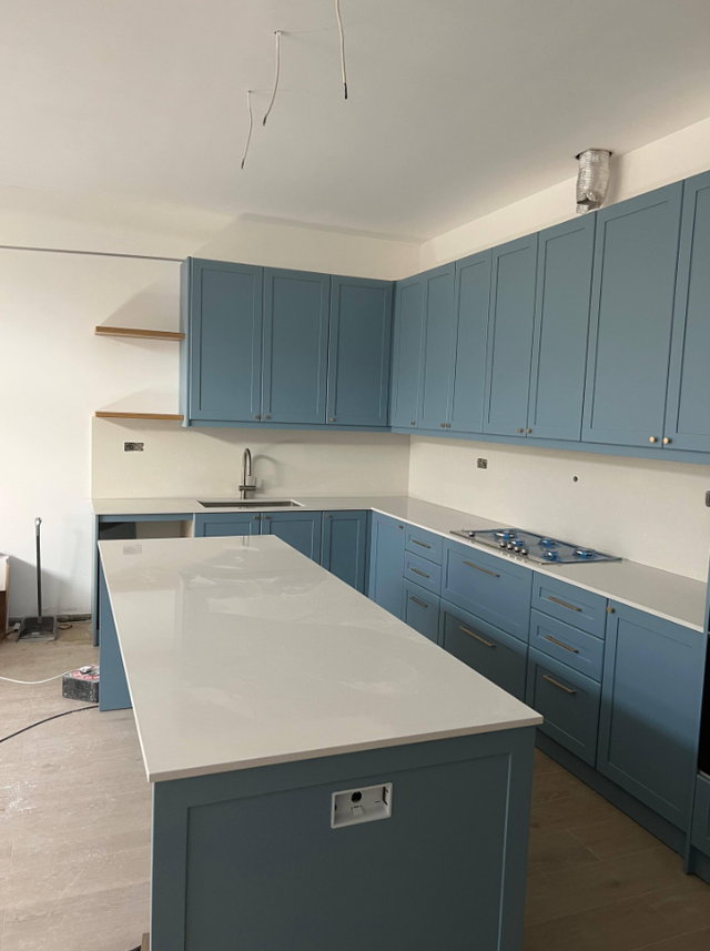 Plain White Countertop With Beautiful Blue Island - Photo 4