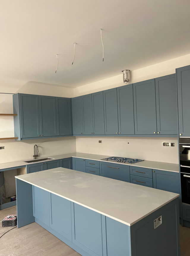 Plain White Countertop With Beautiful Blue Island - Photo 5