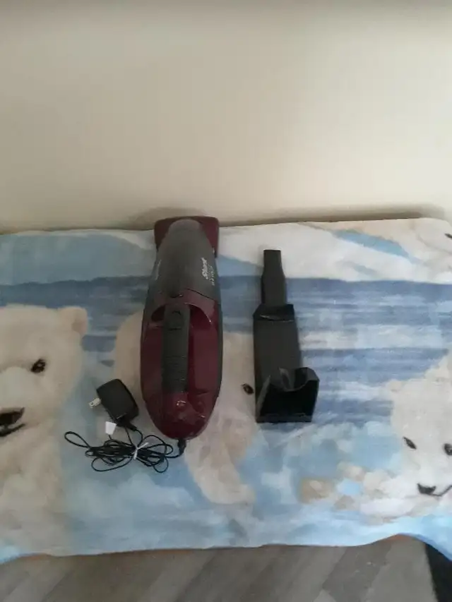 Shark rechargeable vacuum with stand and ac charger $65.00 firm