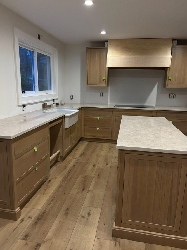 Goldish  Granite Countertop With Wooden Island - Photo 4