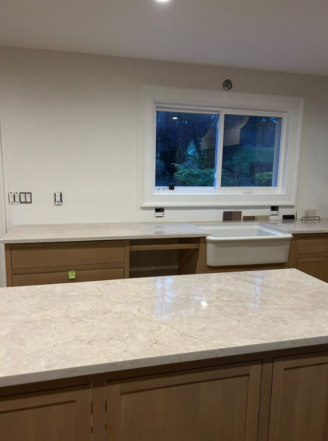 Goldish Granite Countertop With Wooden Island