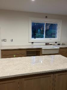 Goldish Granite Countertop With Wooden Island