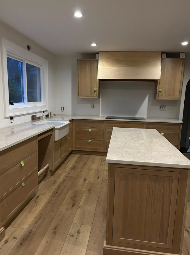 Goldish Granite Countertop With Wooden Island - Photo 2