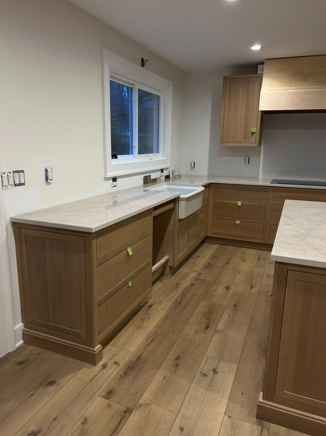 Goldish Granite Countertop With Wooden Island - Photo 5