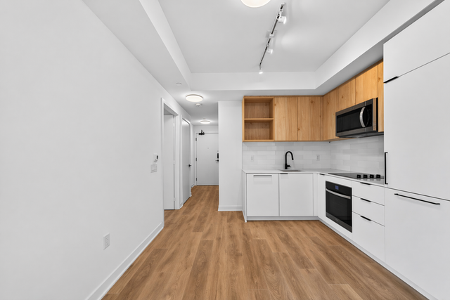 FOR LEASE: Brand-new 1-bedroom   den suite with 631 sq. ft. - Photo 2