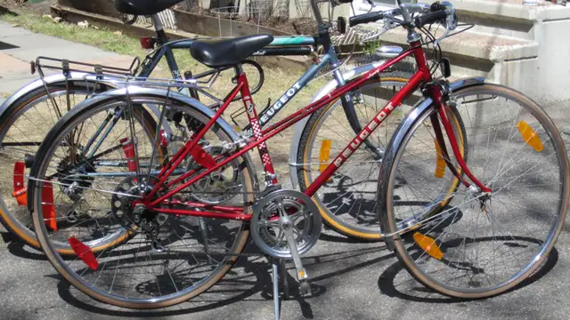 EXCELLENT PAIR OF HIS & HERS PEUGEOT ROAD BIKES ACCESSORIES!!