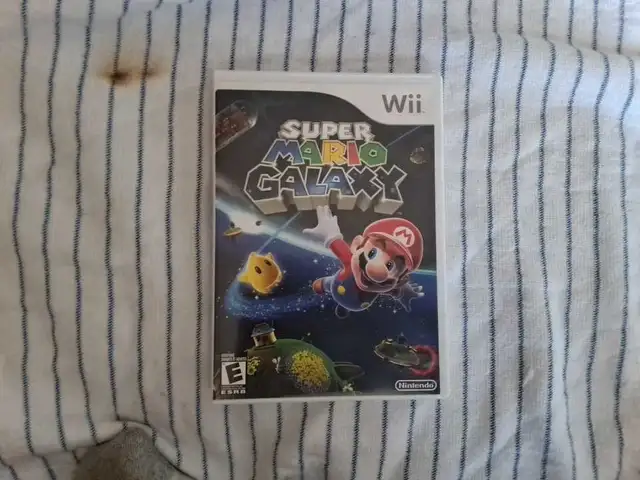 jeux mario galaxy 1 et 2. LIVRAISON POSSIBLE. 20$ chaque - Photo 2