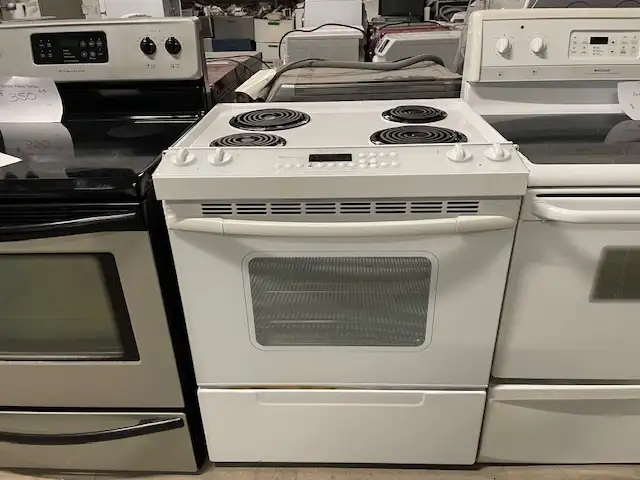Cuisinière blanche encastrable ronds serpentins Whirlpool