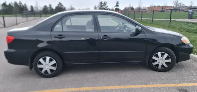 2004 Toyota Corolla Auto AC power locks:/mirrors 416-858-7673 - Photo 2