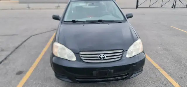 2004 Toyota Corolla Auto AC power locks:/mirrors 416-858-7673 - Photo 4