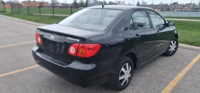 2004 Toyota Corolla Auto AC power locks:/mirrors 416-858-7673 - Photo 5