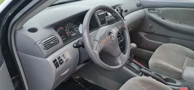 2004 Toyota Corolla Auto AC power locks:/mirrors 416-858-7673 - Photo 6