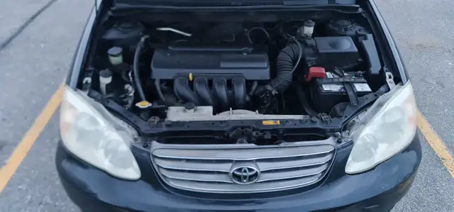 2004 Toyota Corolla Auto AC power locks:/mirrors 416-858-7673 - Photo 8