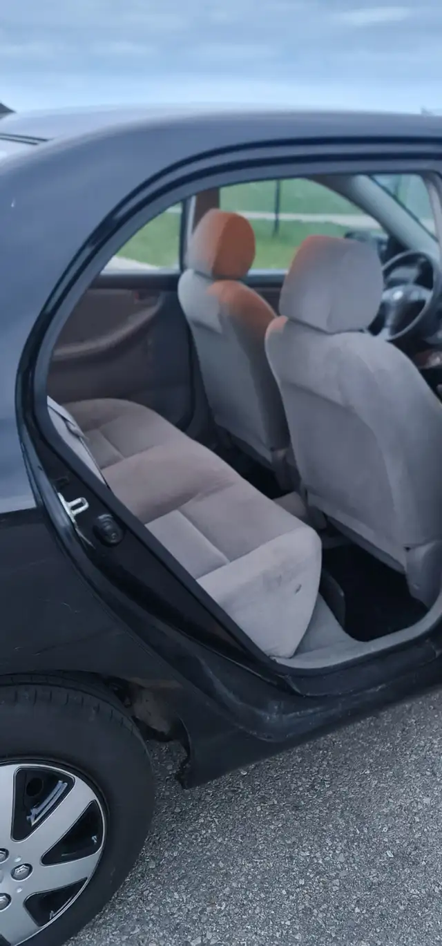 2004 Toyota Corolla Auto AC power locks:/mirrors 416-858-7673 - Photo 9