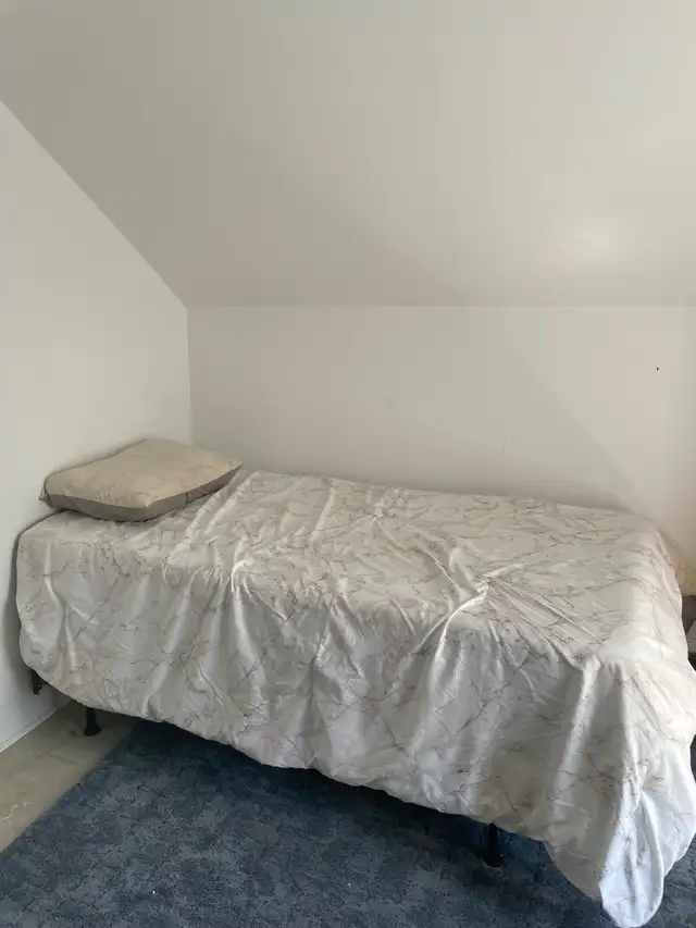 Room for rent with shared accommodations.