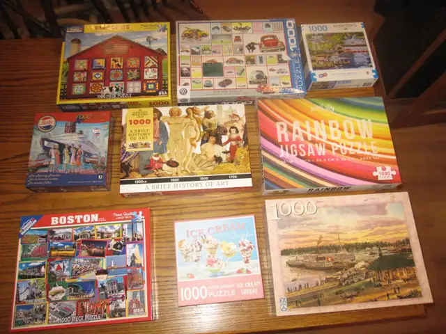 54 JIGSAW PUZZLES USED 1000 PC