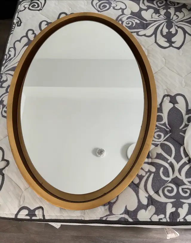Gold oval mirror $100 (has a small dent at the back)