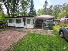 Beautiful trailer with full size add-on steps from the beach!