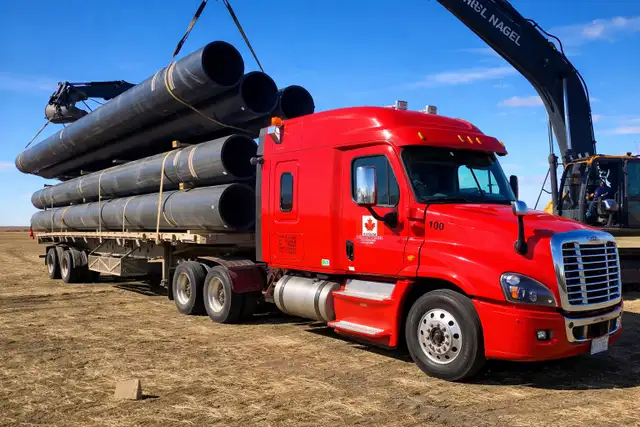 Flatbed Class 1A Driver – $27–$34/hr or 25% Gross – Cross Border