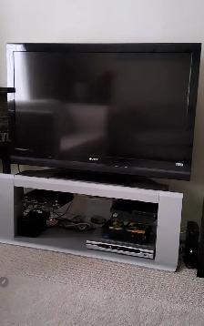 TV stand with glass shelves for $35.00, L 50'× H 18.5