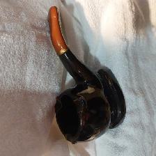 Pipe shaped ashtray