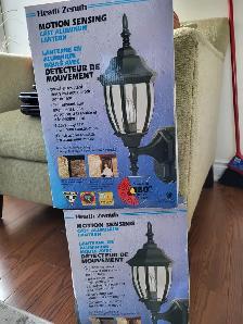 Motion lights for outside - new - two pair.