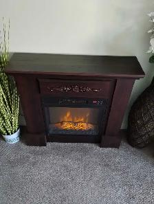 Electric fireplace with mantel.