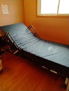 Hospital Bed,  Overbed Table and Wheelchair